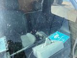 a dog that is sitting in the back seat of a car