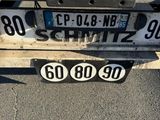 a close up of a license plate on a truck