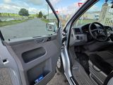 the interior of a car with the door open on a street
