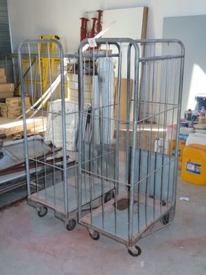 a large metal cage with several items in it