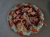 a plate with a bird on it next to a plate with a bird on it