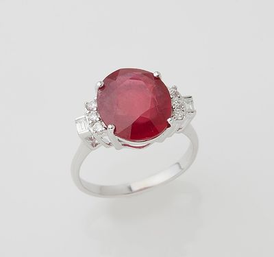an oval ruby and diamond ring