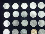 an image of a display case with a variety of coins