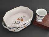 a bowl and a cup sitting on a table