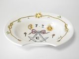 a close up of a bowl with a masonic symbol on it