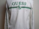 guess white jacket with green logo on the chest