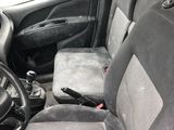the interior of a car with a steering wheel and seat covers