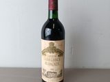 a bottle of wine that is sitting on a table