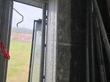 a view of a room with a window and some pipes in it