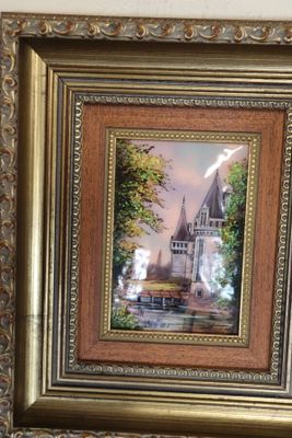 framed picture of a painting of a church with a train coming down the tracks