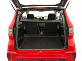 the back of a red car with its trunk open