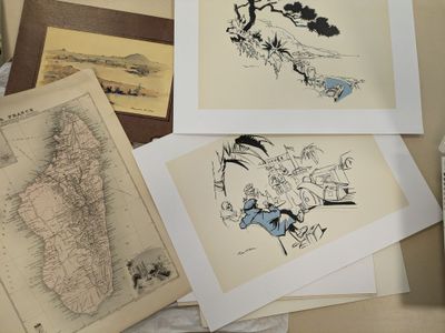 many different pictures of a map on a table