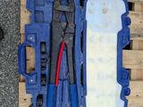 a blue tool case with tools inside of it on a pallet