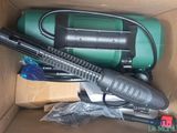 a box that has a vacuum and other items in it