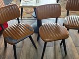 four chairs that are sitting in a room