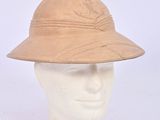 helmet of a man wearing a tan hat on a mannequin head