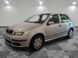 a picture of a silver car parked in a room