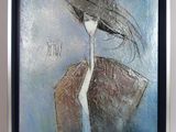 painting of a woman with an umbrella in a frame on a wall