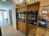 bottles of wine are lined up on the shelves in a wine shop