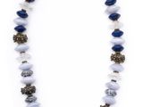 a necklace with blue and white beads on a white background