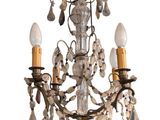 an image of a chandelier with three lights hanging from it ' s ceiling