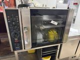 an image of a commercial oven with food inside of it