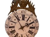 a clock with roman numerals on the face of it