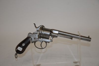 gun on display on clear acrylic stand with white background
