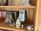 a wooden bookcase with many different items on it