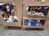 two cardboard boxes that have various items inside of them