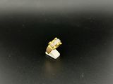 a close up of a gold ring on a black surface