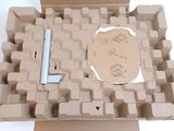 a cardboard box with a computer keyboard inside of it
