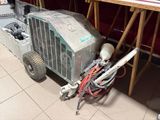 a machine that is sitting on the floor next to a chair