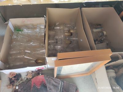 many empty bottles in the box on the table