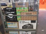 a cart with a lot of items on it in a warehouse