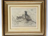 two pheasants in the grass by a gold frame