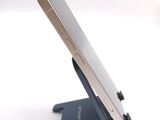 a cell phone that is sitting on top of a stand
