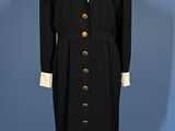 an image of a black and white coat and dress on a mannequin