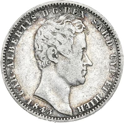 gros plan d'une pièce de monnaie sur laquelle figure une tête d'homme