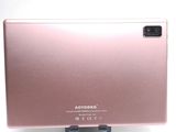 a pink laptop computer sitting on a stand on a white surface
