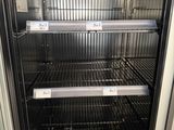a refrigerator that has a lot of empty shelves in it