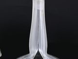 two glass vases that are sitting next to each other