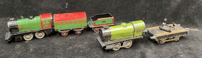 three toy trains sitting next to each other on a table