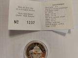 a close up of a coin on a table with a receipt