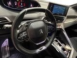 the interior of a car with a steering wheel, dashboard, and display screen
