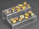 a clear display case with gold bars and other gold bars