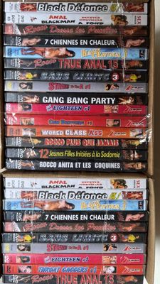 many dvds stacked on top of each other in a box