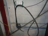 a hose attached to a wall in a garage
