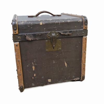 an old trunk that is sitting on a white surface