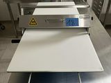 an image of a commercial kitchen with a conveyor belt